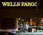 Police lead Ray Reco McNeary away from a St. Cloud Wells Fargo branch following a standoff in May 2021.