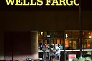 Police lead Ray Reco McNeary away from a St. Cloud Wells Fargo branch following a standoff in May 2021.