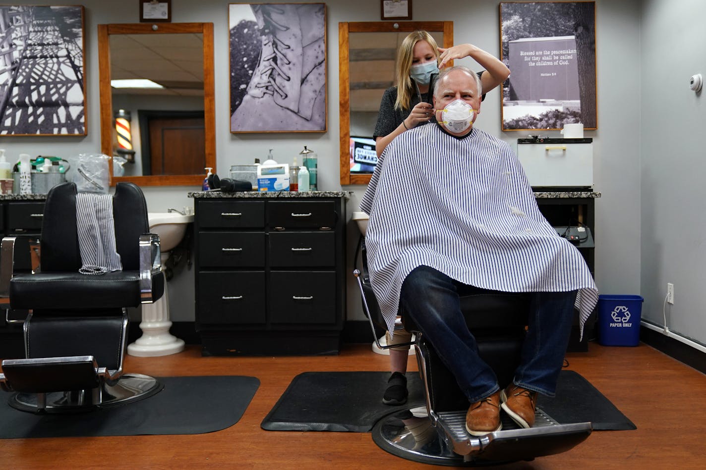 Gov. Tim Walz got his hair cut by Erin Diede as he stopped in Friday morning at Capitol Barbers in the Minnesota State Office Building. ] ANTHONY SOUFFLE • anthony.souffle@startribune.com Gov. Tim Walz went for a haircut at Capitol Barbers then toured some of the sites where looting and vandalism occurred during the George Floyd protests and riots Friday, June 5, 2020 in Minneapolis.