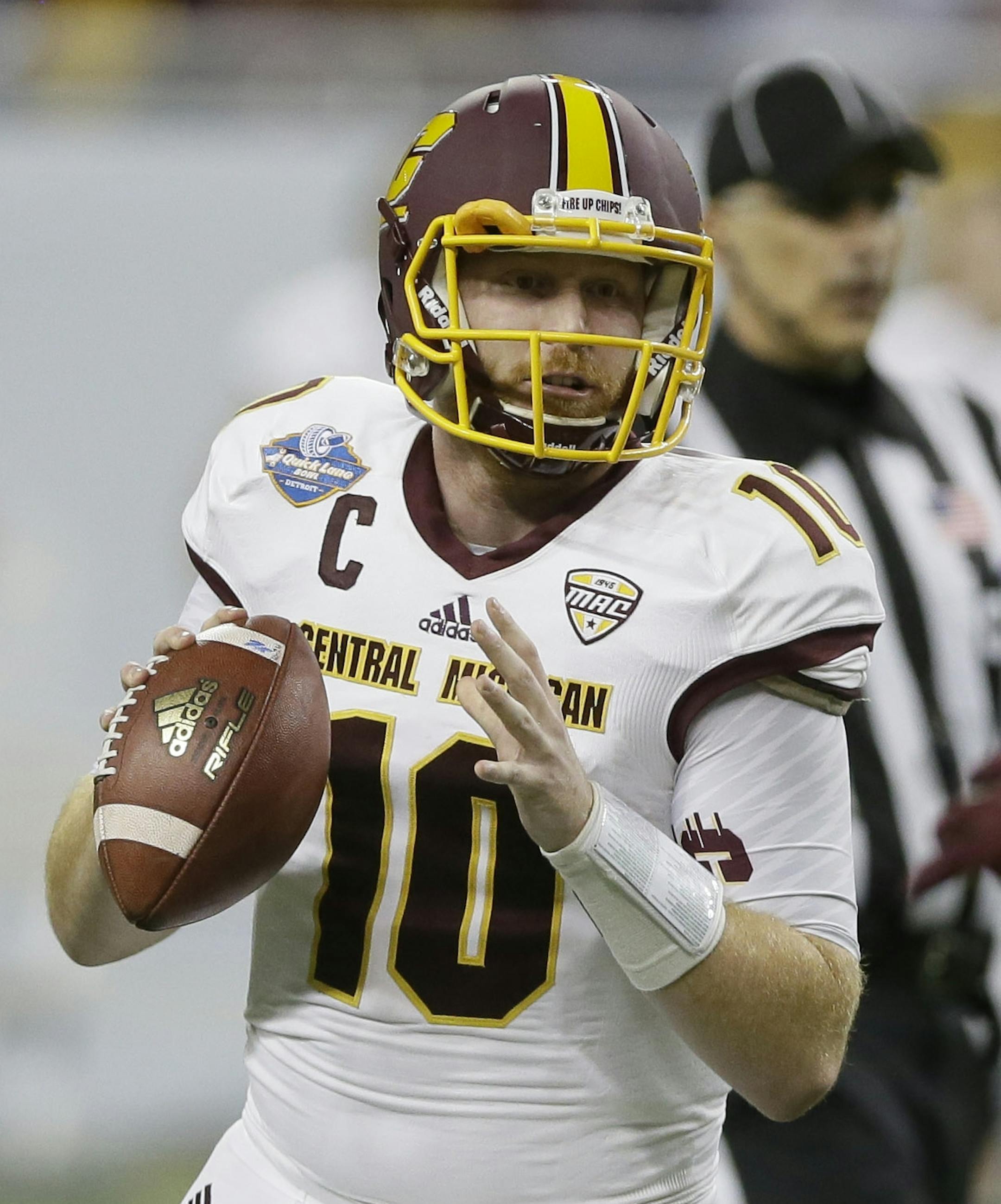 Central Michigan quarterback Cooper Rush looks to pass during the first half of the Quick Lane Bowl NCAA college football game against Minnesota, Monday, Dec. 28, 2015, in Detroit. (AP Photo/Carlos Osorio)