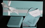FILE - This Nov. 27, 2012, file photo, shows Tiffany & Co. gift boxes displayed in Boston. Tiffany & Co. reports financial earnings Tuesday, Nov. 29, 