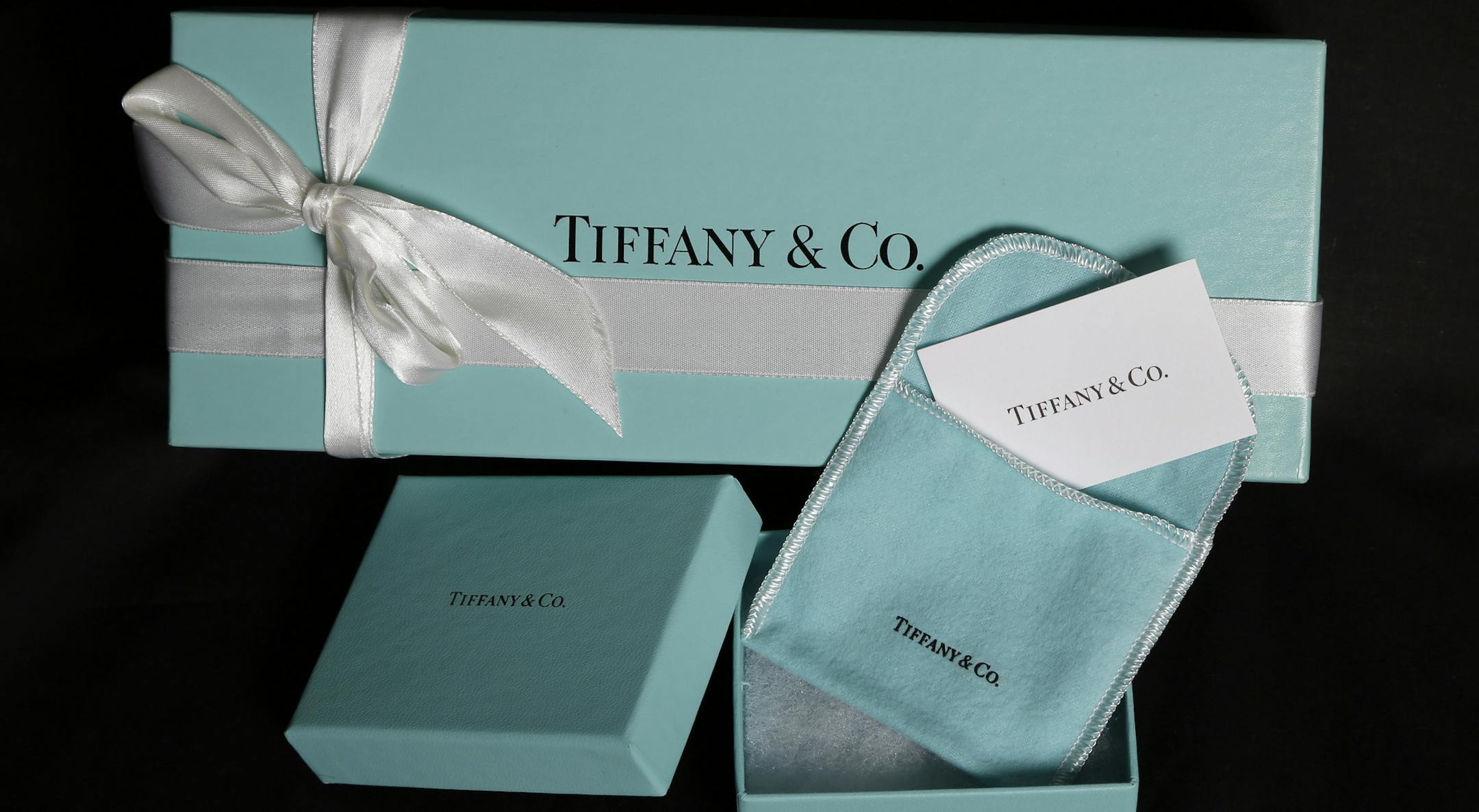 FILE - This Nov. 27, 2012, file photo, shows Tiffany & Co. gift boxes displayed in Boston. Tiffany & Co. reports financial earnings Tuesday, Nov. 29, 2016. (AP Photo/Elise Amendola, File)
