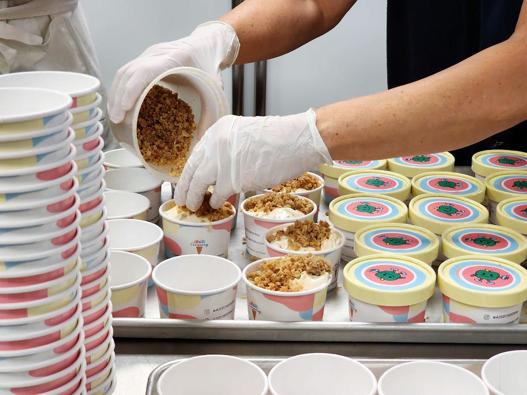 The assembly line at A to Z Creamery, where every cup for the 2023 Minnesota State Fair is packed by hand.