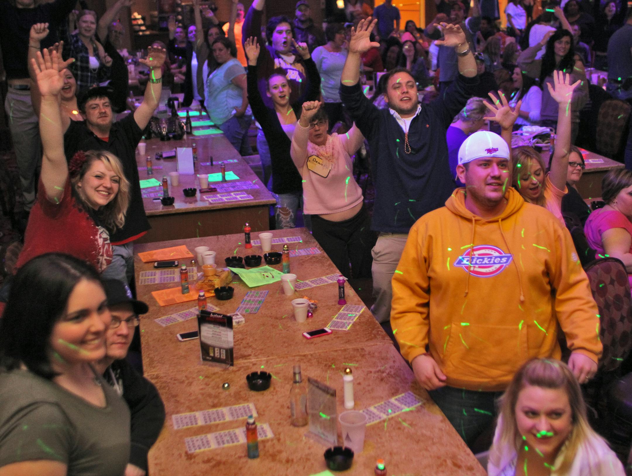 Mystic Lake Casino sponsors "cosmic bingo" with neon lights and DJ's to draw a younger cliental to the bingo market. Bingo patrons called out for glow-in-the-dark necklaces that the DJ distributed. (MARLIN LEVISON/STARTRIBUNE(mlevison@startribune.com (cq )