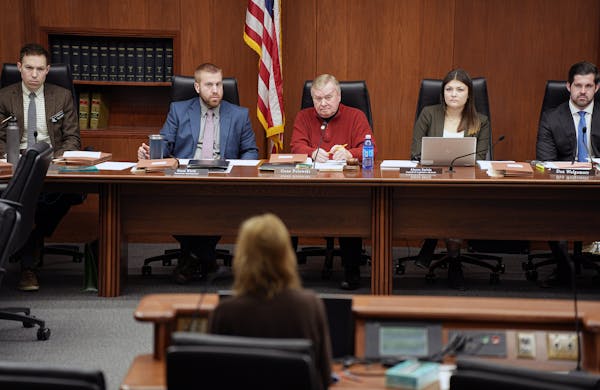 University of Minnesota Budget Director Julie Tonneson, center, appeared before the Minnesota House Higher Education Finance and Policy Committee earl