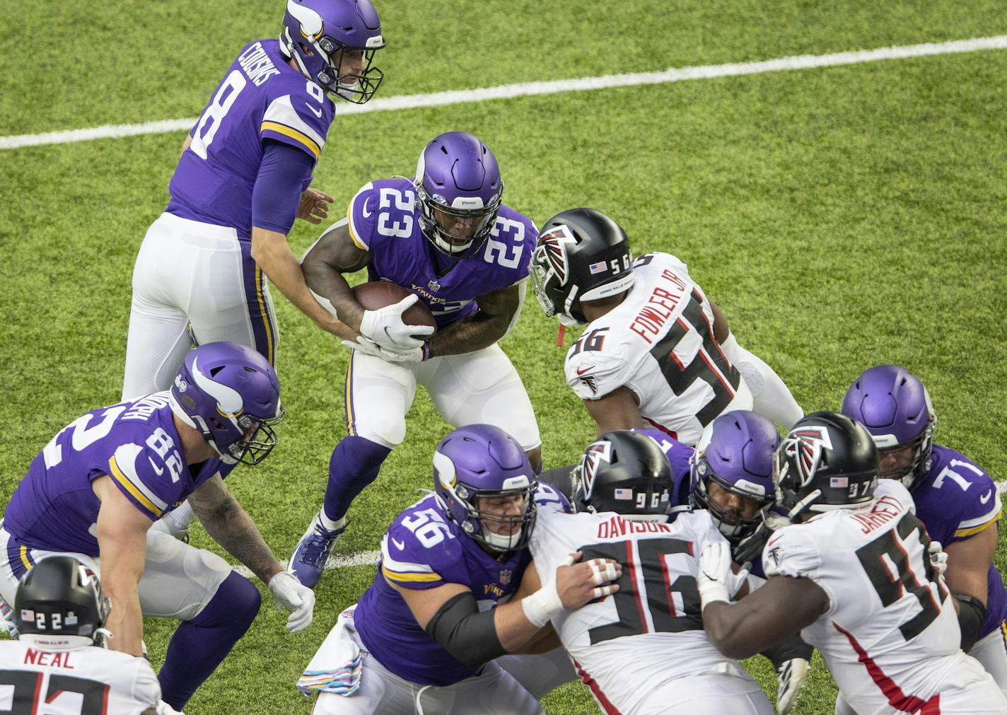 Minnesota Vikings running back Mike Boone (23) was met in the backfield by Dante Fowler Jr. (56) of the Atlanta Falcons on fourth and goal in the first quarter. ] CARLOS GONZALEZ • cgonzalez@startribune.com – Minneapolis, MN – October 18, 2020, NFL, ——— The Minnesota Vikings played the Atlanta Falcons at U.S. Bank Stadium in Minneapolis on Sunday, October 18, 2020.