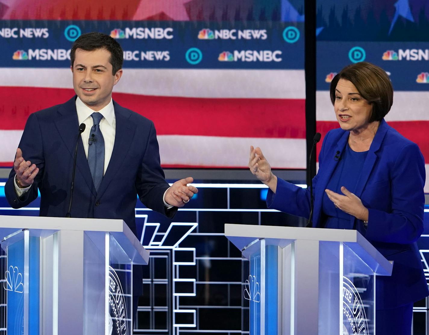 Pete Buttigieg and Sen. Amy Klobuchar (D-Minn.) look to the moderators during the Democratic presidential debate at the Paris Theater in Las Vegas, on Wednesday, Feb. 19, 2020. (Erin Schaff/The New York Times)