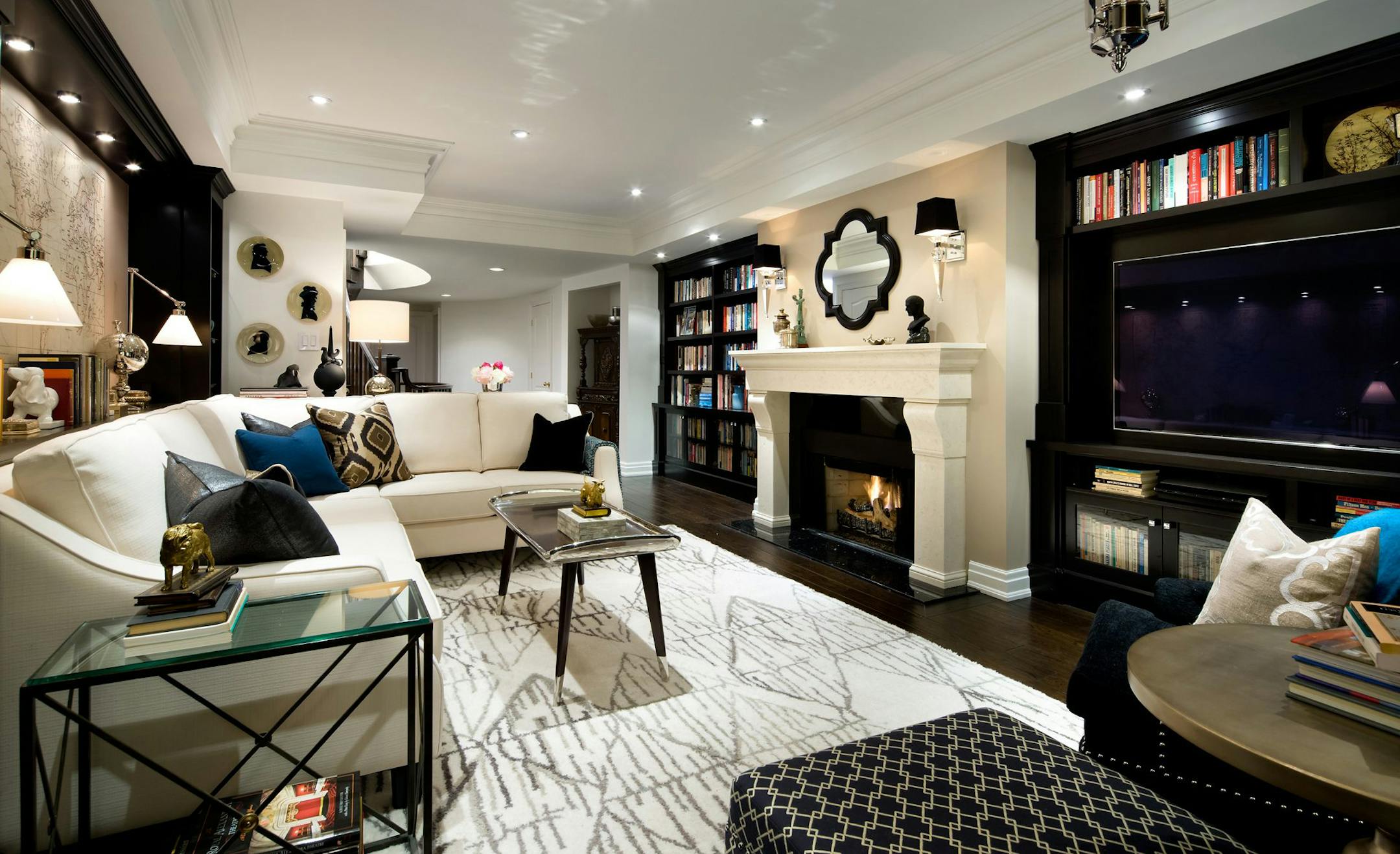 The focal point of this book lover's retreat is the fireplace, which features a new mantel and classic surround. The room also now has three walls of custom floor-to-ceiling shelving around the room, maximizing every possible inch of storage space for books. (Brandon Barre/MCT) ORG XMIT: 1147219