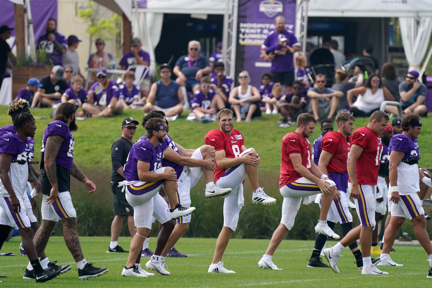 Minnesota Vikings fans watched as quarterback Kirk Cousins (8) led the team in stretches during training camp Friday. ] ANTHONY SOUFFLE • anthony.souffle@startribune.com