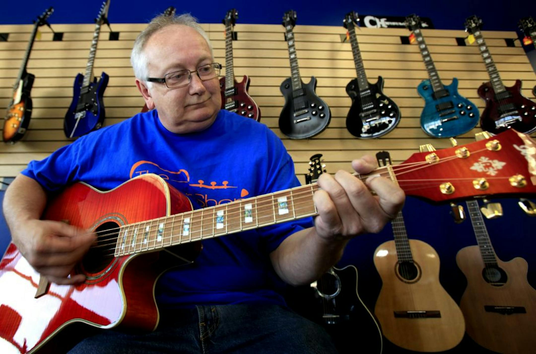 Brad Wegner, owner of The Guitar Shop, has found his calling. Once a banker,­
Wegner opened the shop in April and even has a stage for musicians to jam on.