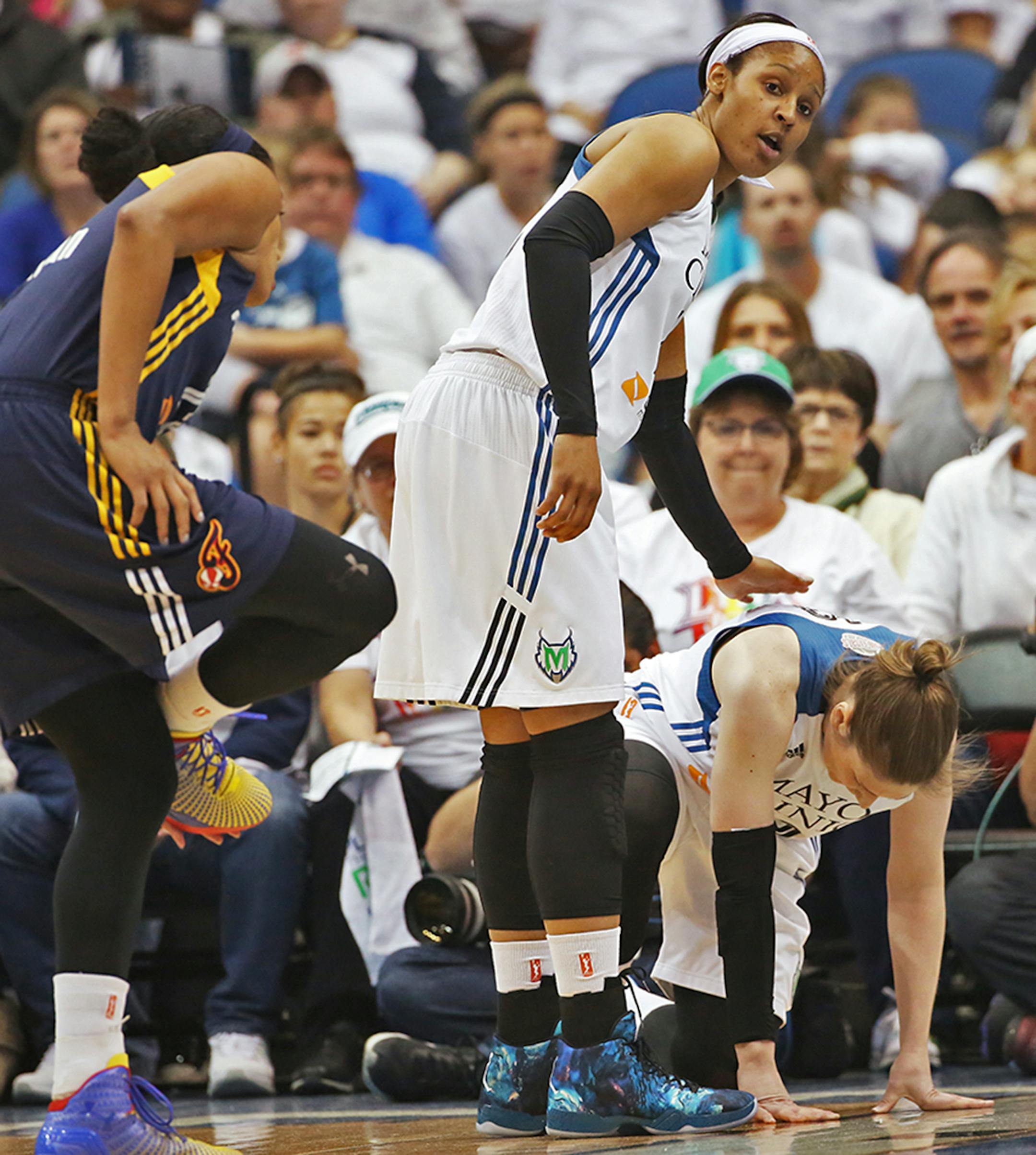 Minnesota Lynx guard Lindsay Whalen (13) seems to hurt herself during the first quarter.