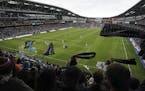 In this April 13, 2019, photo, Minnesota United wave their scarves as the team tried unsuccessfully for the game-winning goal in the second half again