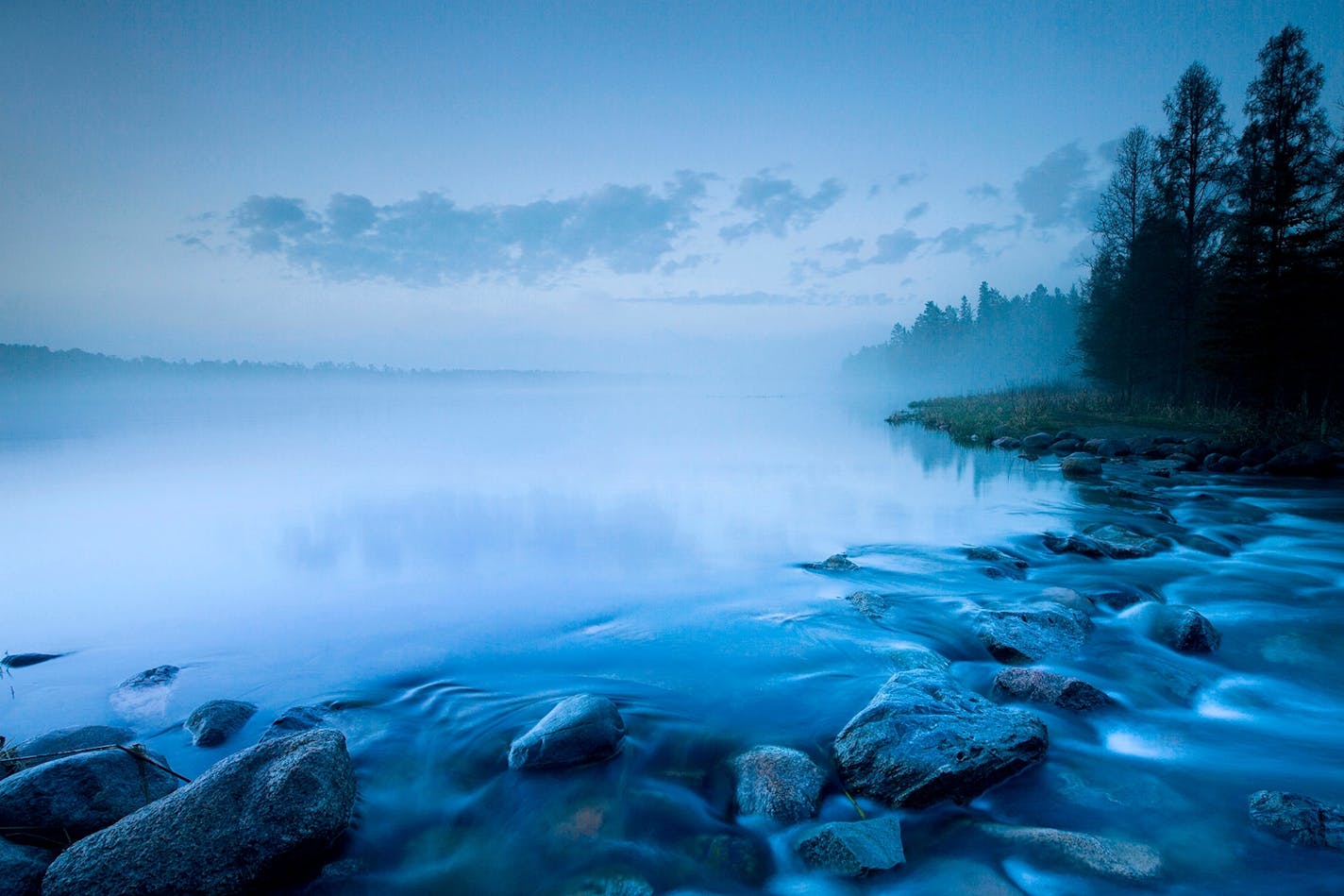 Dawn breaks on the Mississippi headwaters in Itasca State Park.