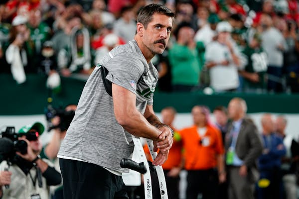 New York Jets quarterback Aaron Rodgers stands on the field before an NFL football game against the Kansas City Chiefs, Sunday, Oct. 1, 2023, in East 