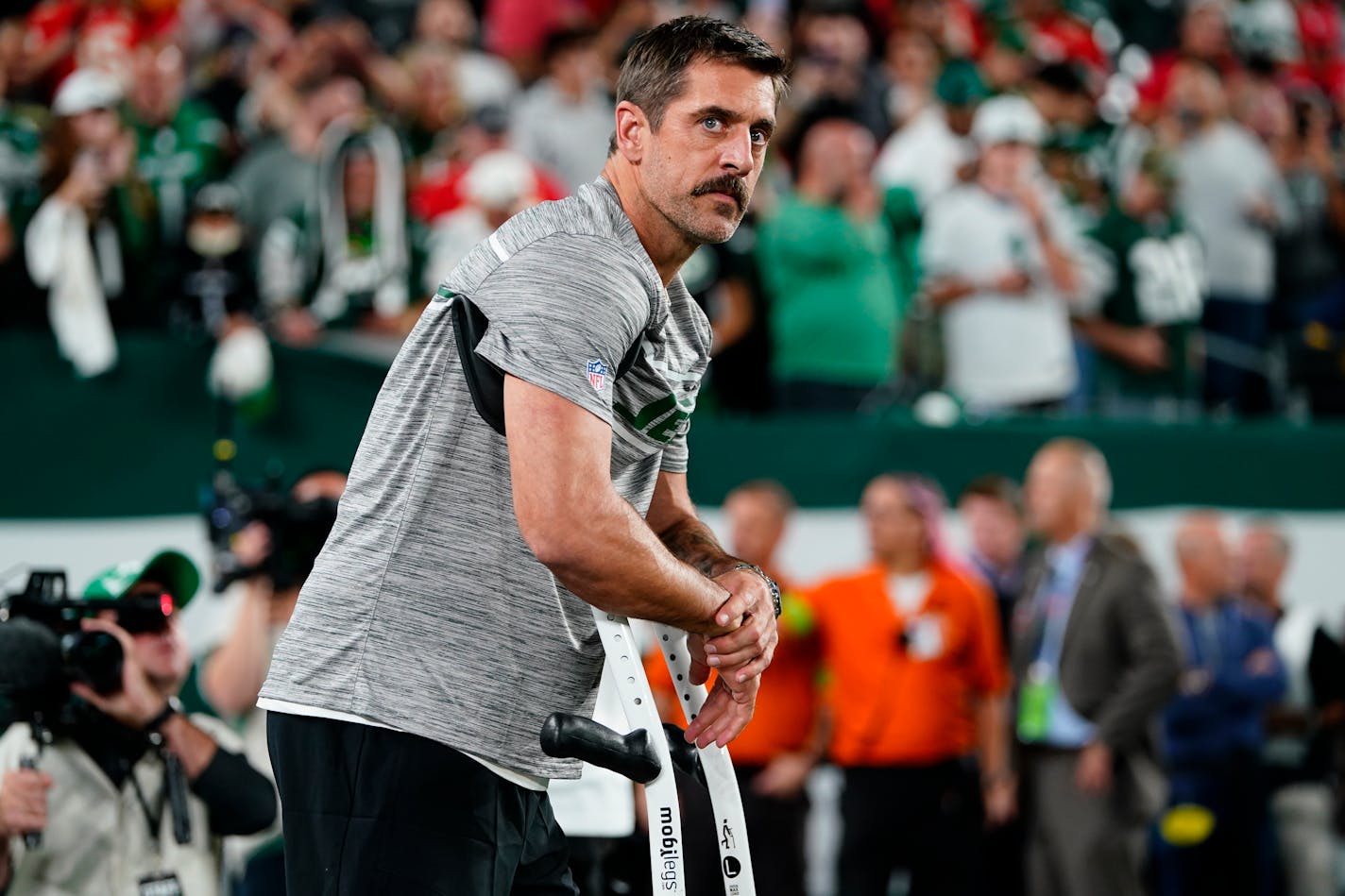 New York Jets quarterback Aaron Rodgers stands on the field before an NFL football game against the Kansas City Chiefs, Sunday, Oct. 1, 2023, in East Rutherford, N.J. (AP Photo/Frank Franklin II)