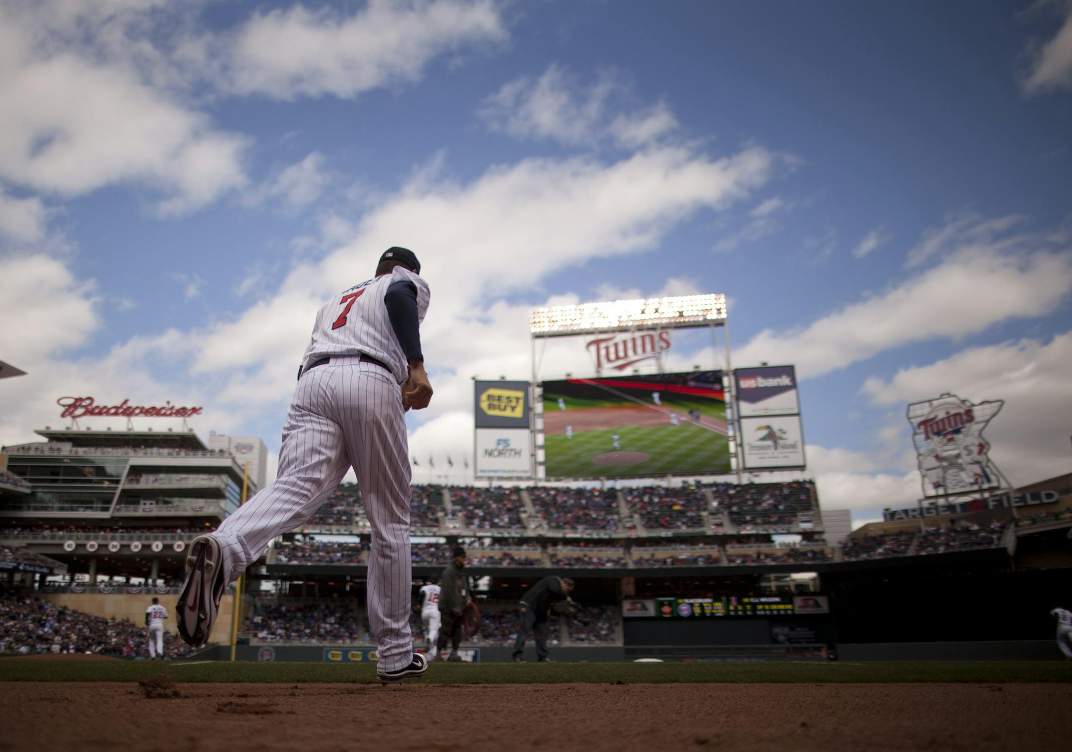 The Twins' Home Opener was against the Los Angeles Angels at Target Field in Minneapolis, Minn. on Monday afternoon, April 9. 2012. The Twins' Joe Mauer headed to first base at the start of the home opener Monday afternoon. ] JEFF WHEELER ‚Ä¢ jeff.wheeler@startribune.com