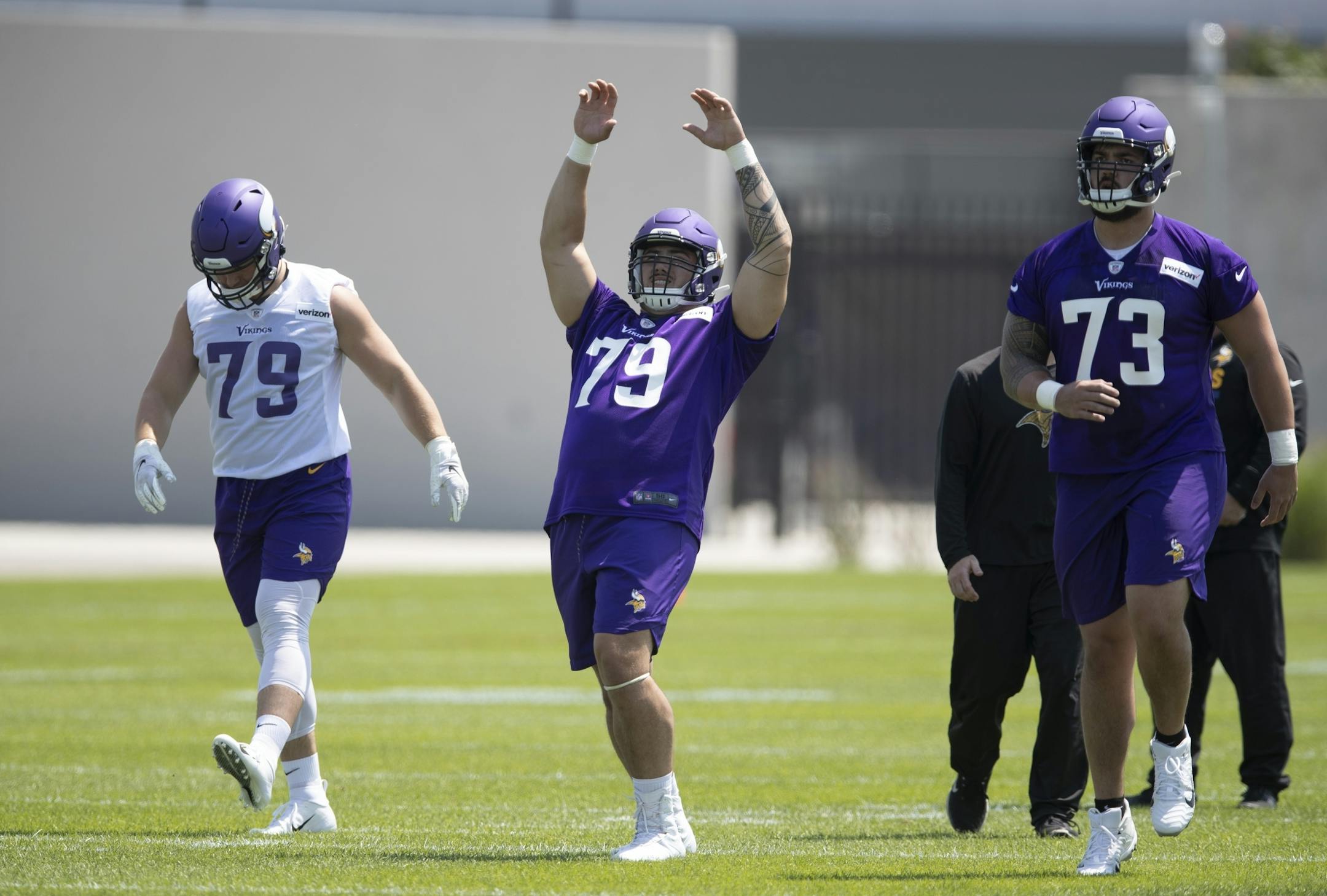 Vikings rookies Karter Schult left Tiano Pupungatoa, and Dru Samia warmed up during the first day of training for Vikings rookies at TCO Performance Center Tuesday July,23 2019 in Eagan, MN.