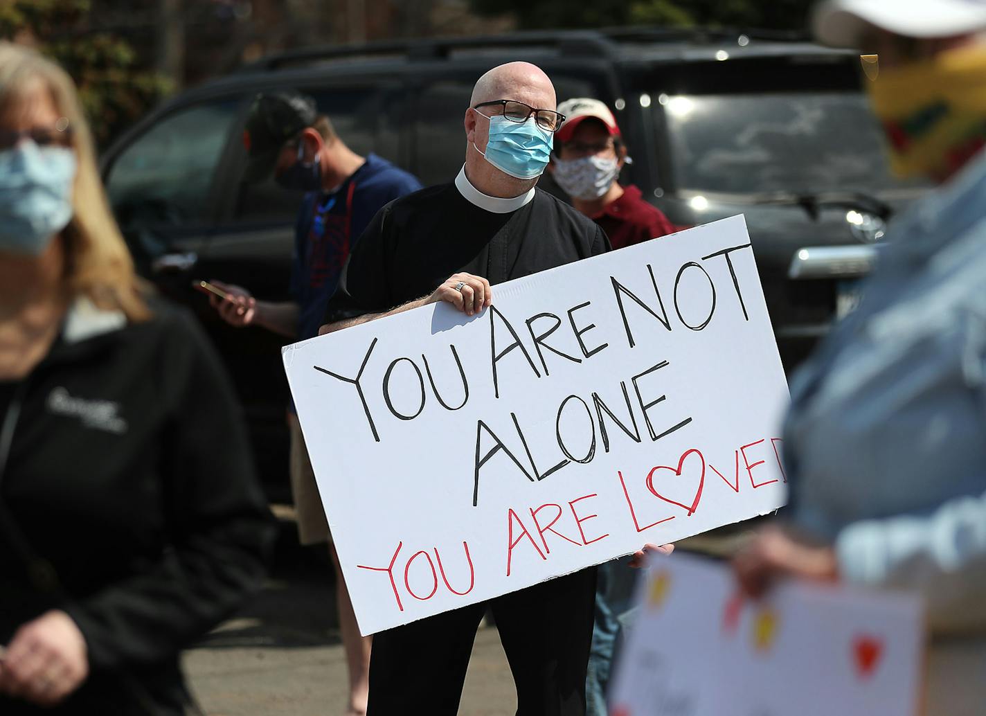 The Rev. Phil Rose of Episcopal Homes was among about 80 people who came out to support workers and residents of St. Therese of New Hope on Friday.