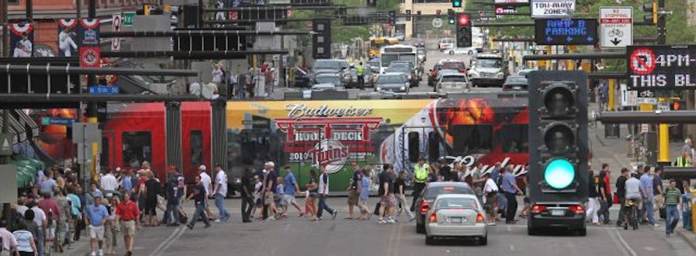 Crazy traffic and foot traffic occured at 5th street and North 1st Ave, in downtown Minneapolis because of Get Motivated seminar at the Target Center and the Twins game. The seminar is a notorious traffic clogger in cities nationwide. On Wednesday, the 20,000 expected to attend will descend on downtown Minneapolis during morning rush hour, then leave just as Twins fans are heading to nearby Target Field for a night game against the Yankees. The city of Minneapolis is already ramping up its traff