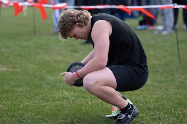 Rosemounts Hayden Bills takes a moment before competing and winning the boys discus throw during the Hamline Elite Meet at Hamline University in St. P