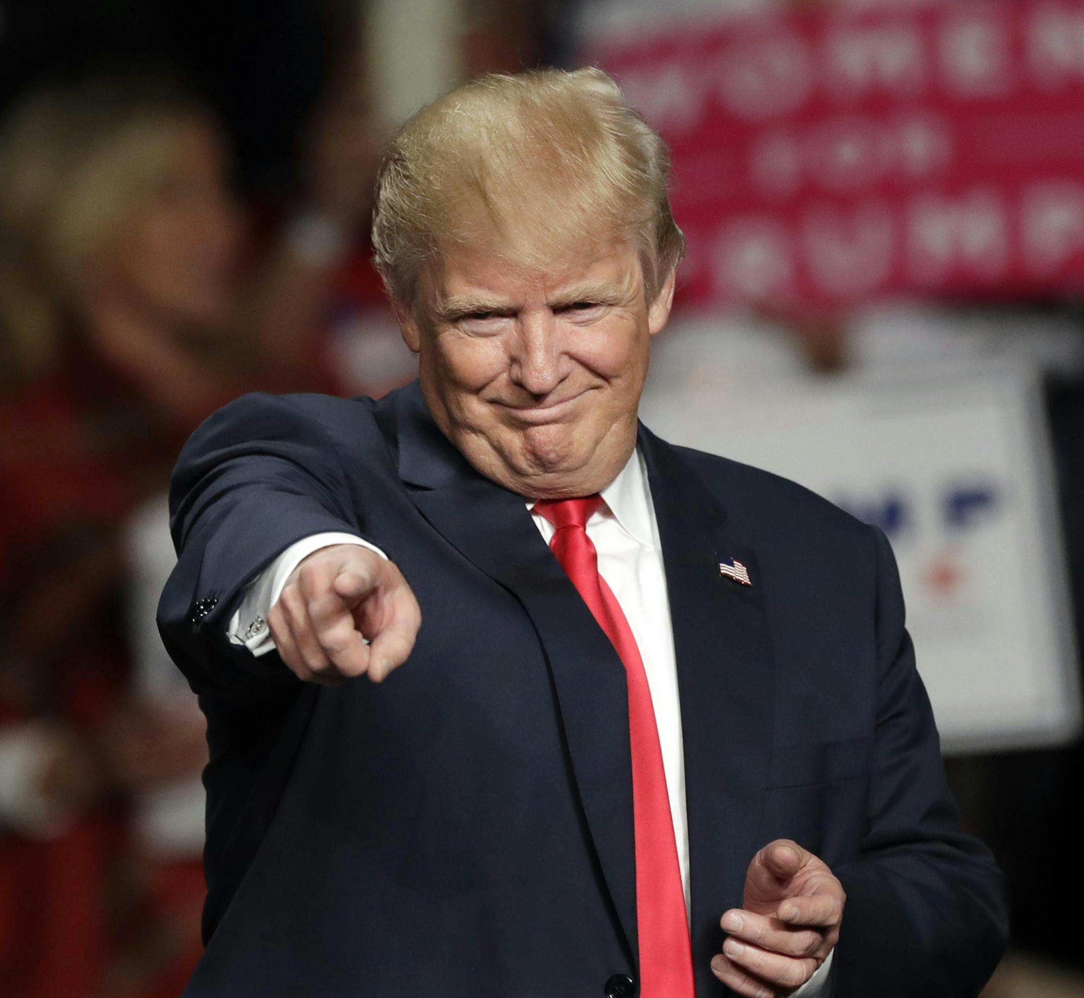 Republican presidential candidate Donald Trump acknowledges the crowd before speaking at Macomb Community College, Monday, Oct. 31, 2016, in Warren, Mich. (AP Photo/Carlos Osorio)
