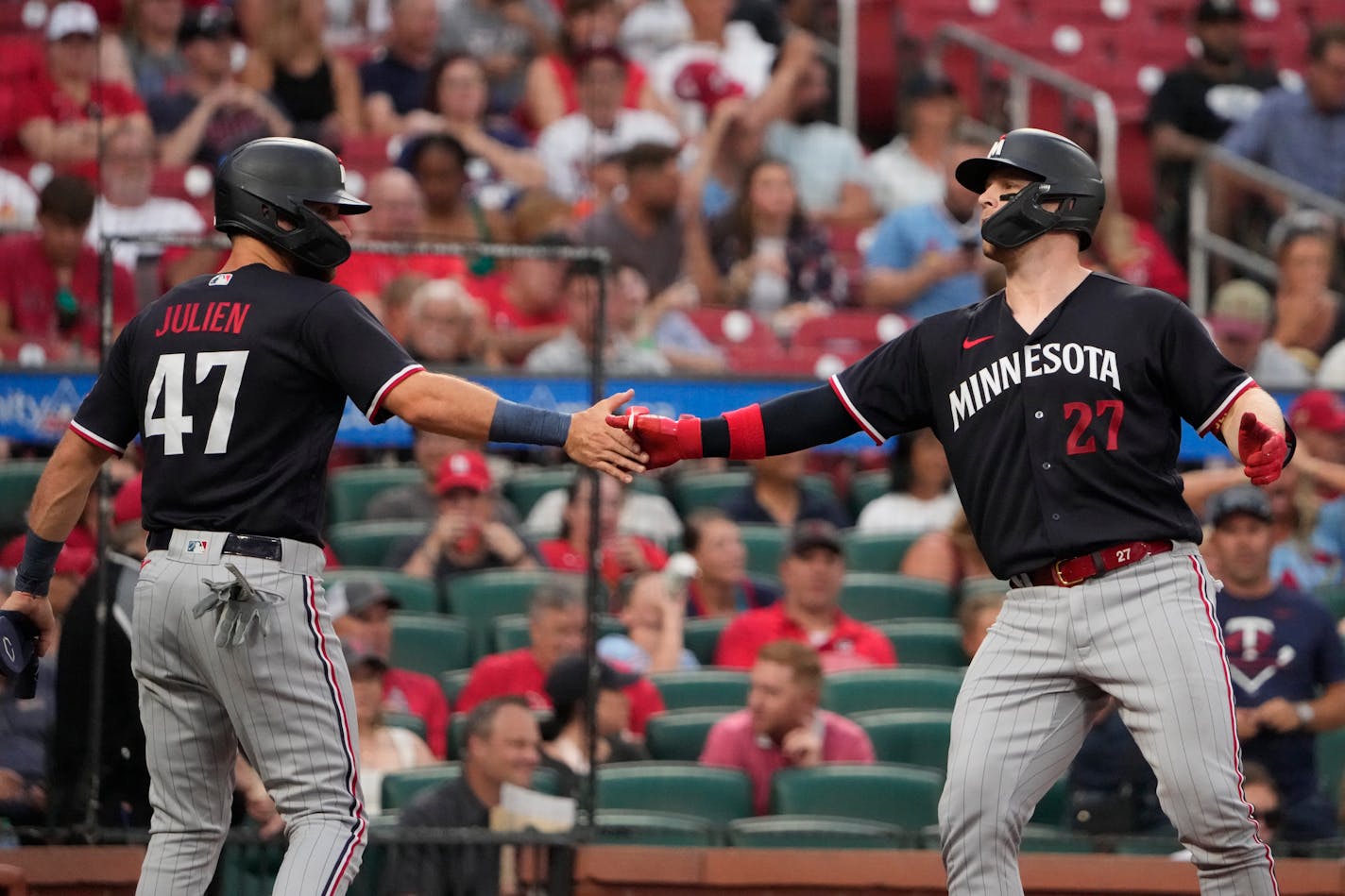 Minnesota Twins' Ryan Jeffers (27) is congratulated by teammate Edouard Julien (47) after hitting a two-run home run during the second inning of a baseball game against the St. Louis Cardinals Thursday, Aug. 3, 2023, in St. Louis. (AP Photo/Jeff Roberson)