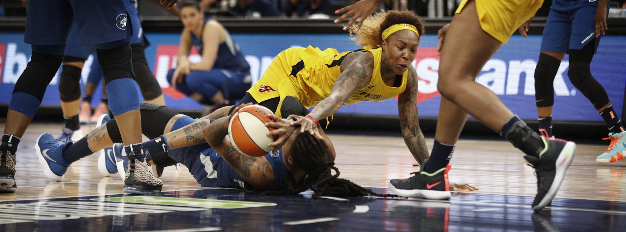 Lynx Erlana Larkins and Fever Cappie Pondexter fought for a loose ball at Target Center Wednesday July 18, 2018 in Minneapolis , MN.
