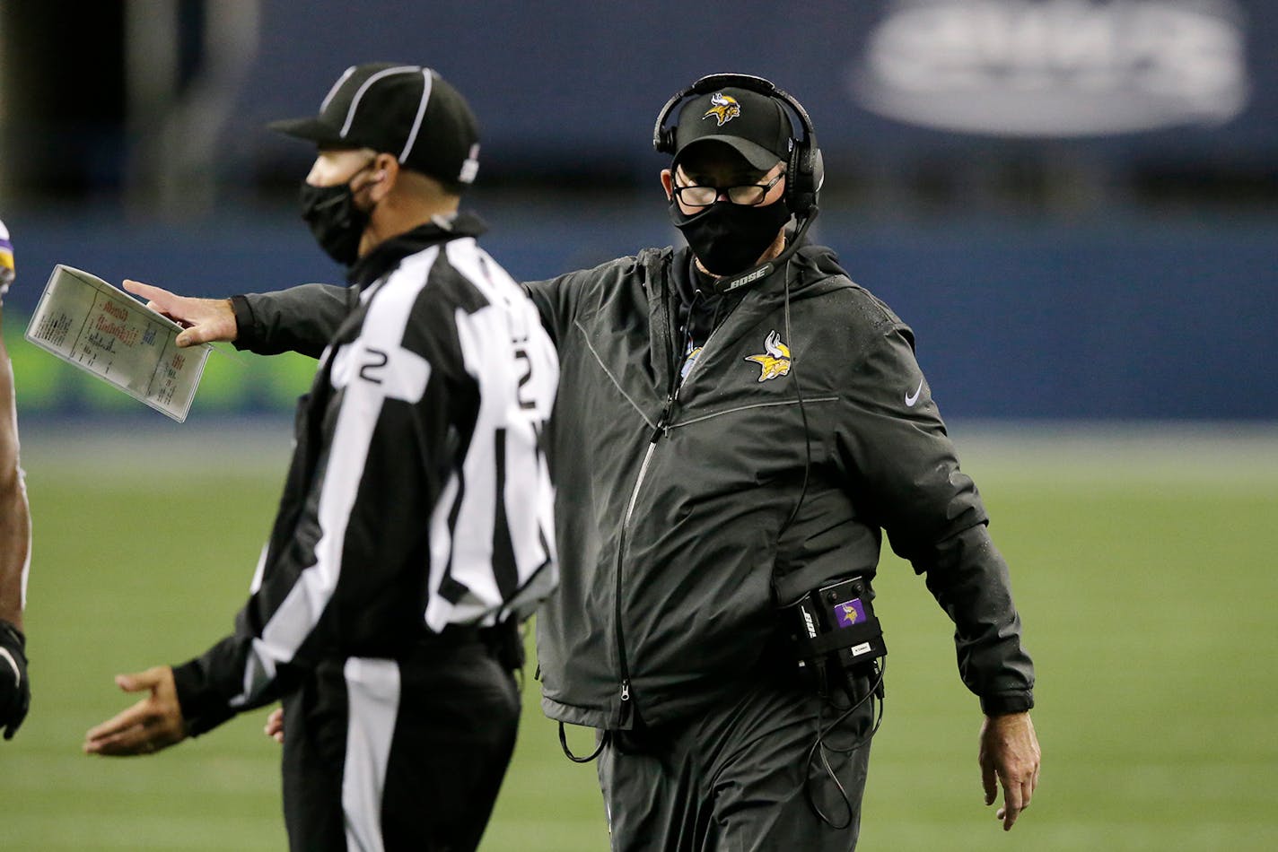 Minnesota Vikings head coach Mike Zimmer talks with an official during the second half of an NFL football game against the Seattle Seahawks, Sunday, Oct. 11, 2020, in Seattle. (AP Photo/John Froschauer)