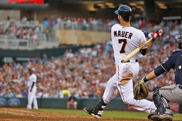 Joe Mauer of the Twins hit a three run home run against the Brewers on June 5.