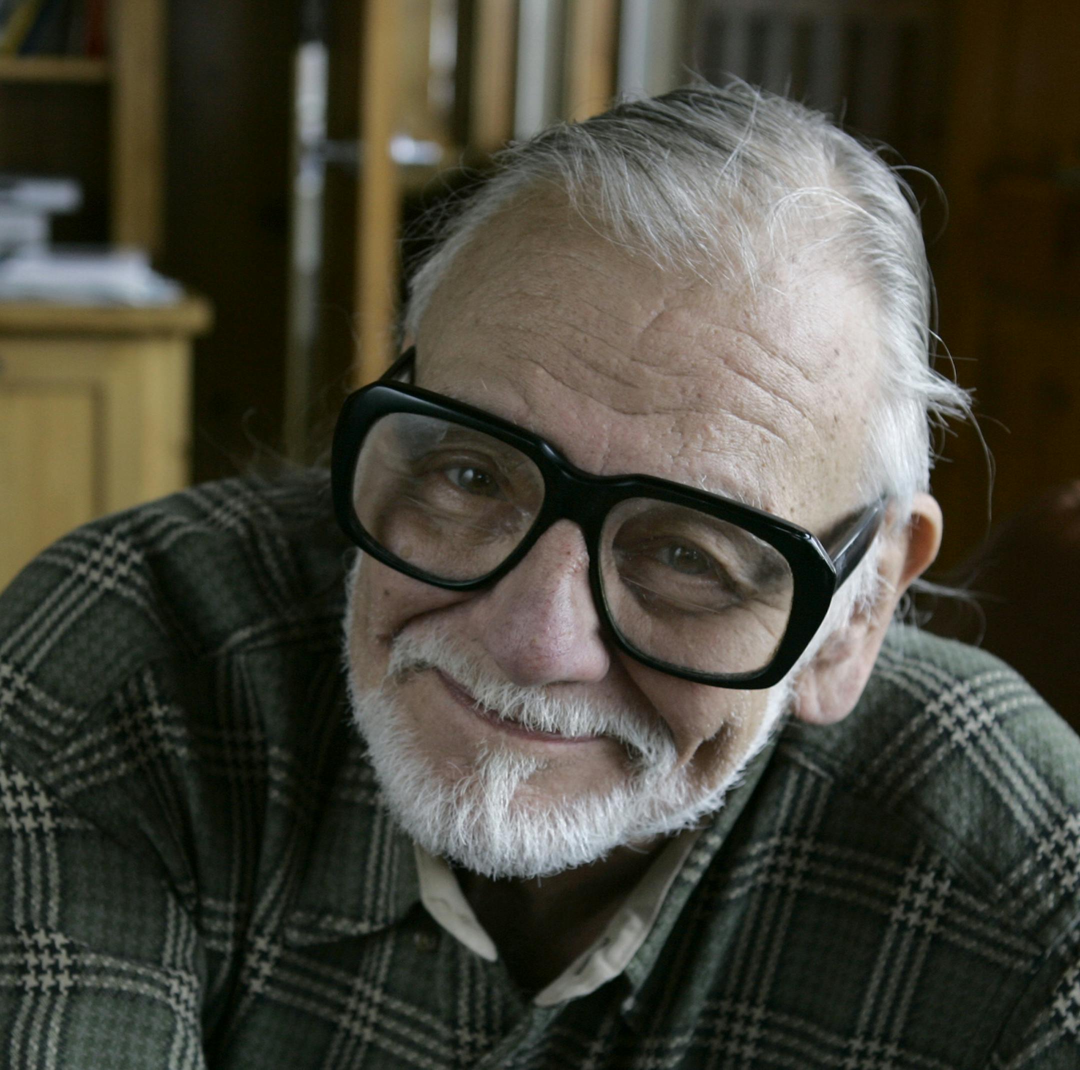 FILE - In this Monday, Jan. 21, 2008 file photo, director and writer George Romero poses for a photograph while talking about his film "Diary of the Dead' at the Sundance Film Festival in Park City, Utah. George Romero, whose classic "Night of the Living Dead" and other horror films turned zombie movies into social commentaries and who saw his flesh-devouring undead spawn countless imitators, remakes and homages, has died. He was 77. Romero died Sunday, July 16, 2017 following a battle with lung