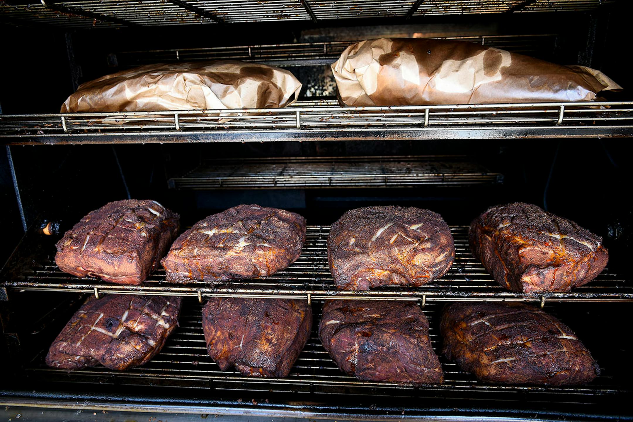Pork butts and briskets being smoked at OMC Smokehouse Thursday. ] AARON LAVINSKY ï aaron.lavinsky@startribune.com Annual food travel issue heads to Duluth, where a lot of new restaurants are popping up. We photograph restaurants and scenic Duluth on Wednesday, June 6 and Thursday, June 7, 2018.