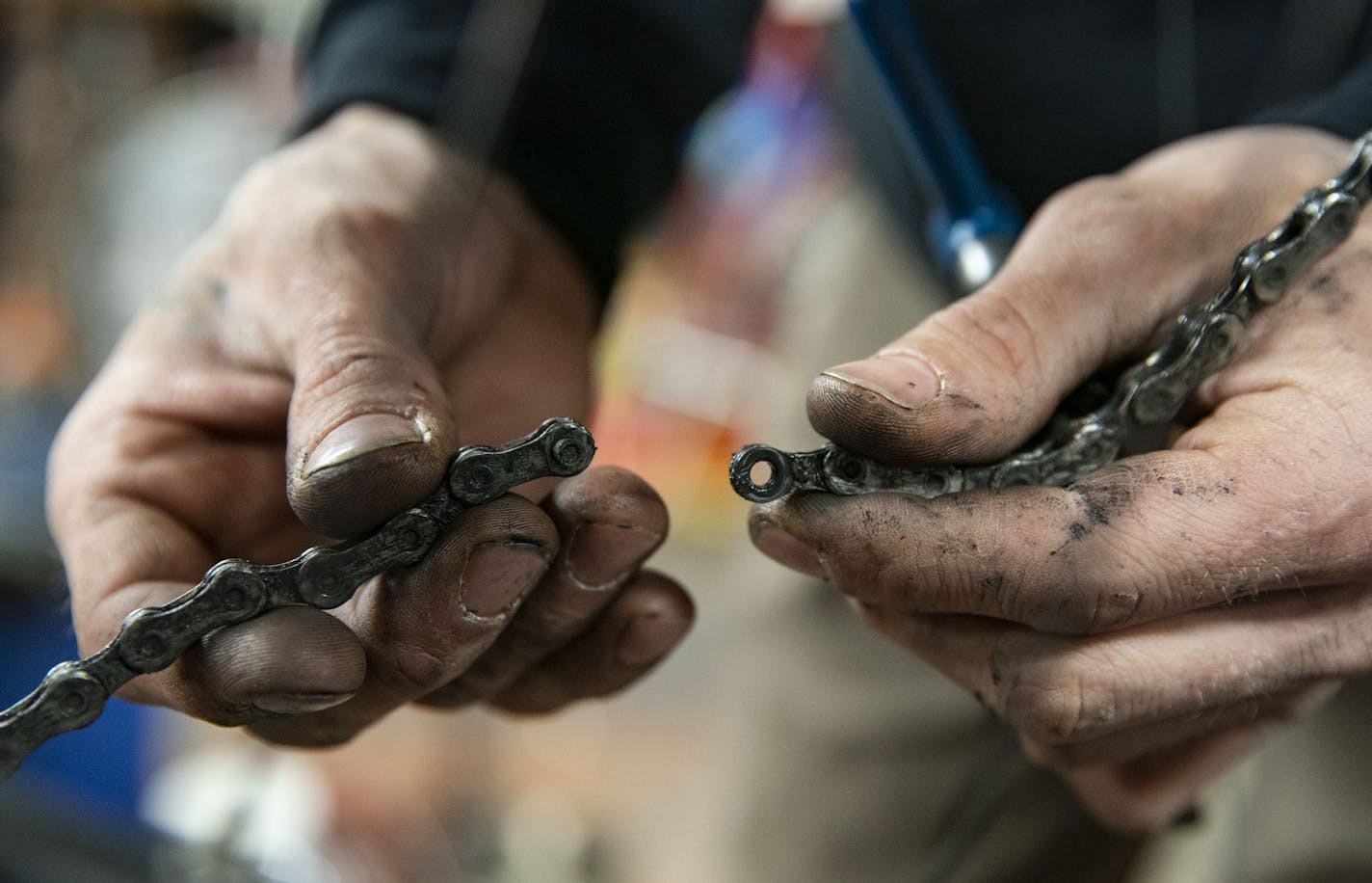 Cassidy Olson a mechanic at Twin Ports Cyclery, separated a chain on a bike on Friday afternoon in Duluth.