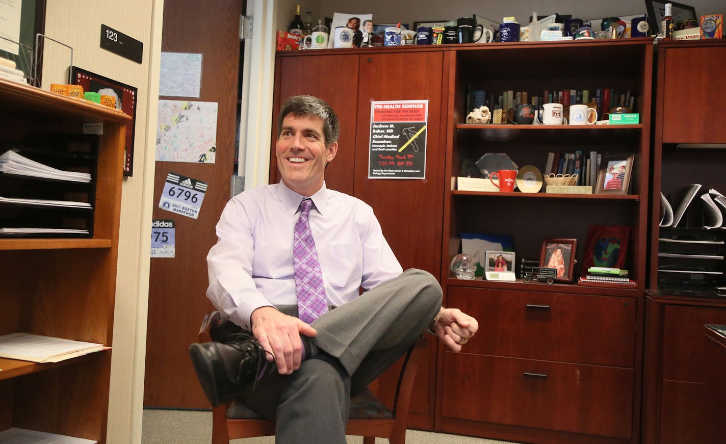 Hennepin County Medical Examiner's office Chief Medical Examiner Dr. Andrew Baker in his office at the Hennepin County Medical Examiner's office Thursday, June 28, 2015 in Minneapolis, MN.](DAVID JOLES/STARTRIBUNE)djoles@startribune.com Families visiting the medical examiner's office for the traumatizing experience of identifying a loved one must search for parking in the shadow of the new Vikings stadium. The location of Chief Medical Examiner Dr. Andrew Baker's office is less than ideal and li