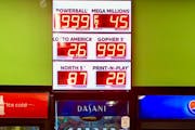 The size of the Powerball jackpot has grown to a figure that promotional signs such as this one in downtown Minneapolis couldn't accurately reflect Tu