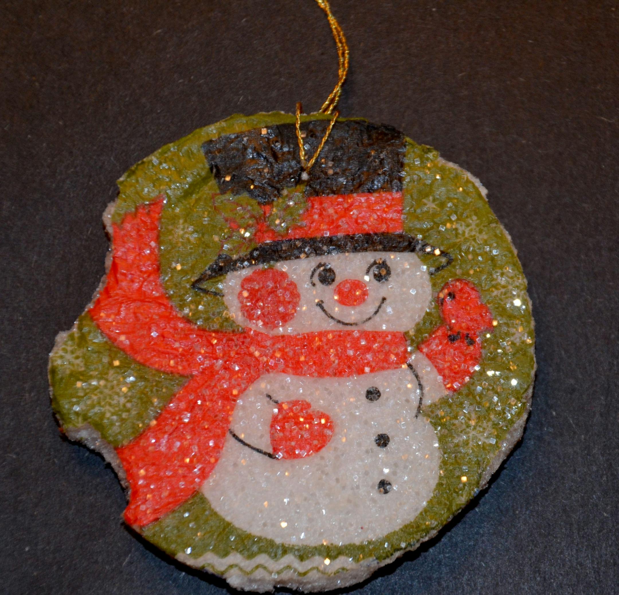 Lynne Lind's son Eric made this styrofoam ornament in 1978 when he was a first-grader. He hung it proudly on the tree. But when they took the tree down, they noticed that his toddler brother had taken two bites out of it.
