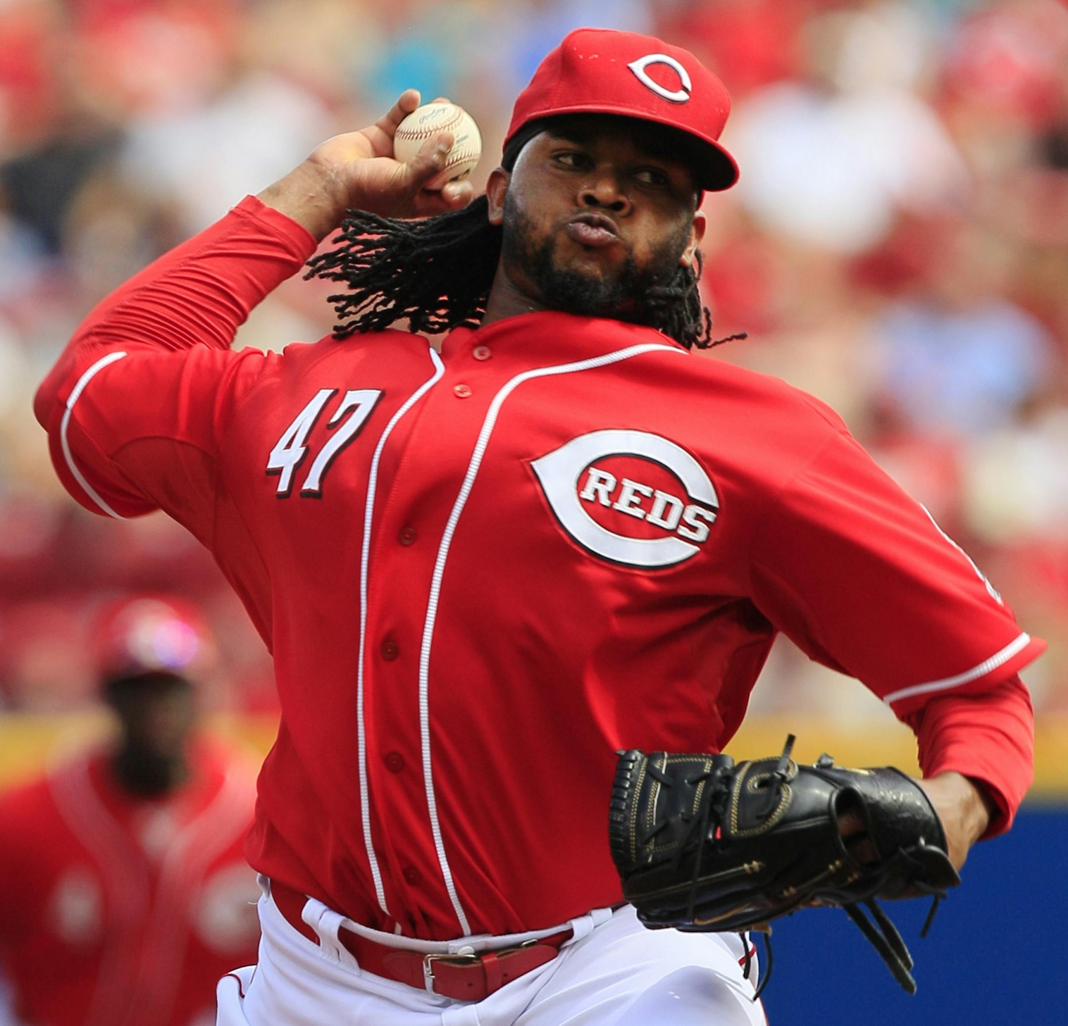 Cincinnati Reds starting pitcher Johnny Cueto throws against the Minnesota Twins in the first inning of a baseball game on Saturday, June 23, 2012, in Cincinnati.