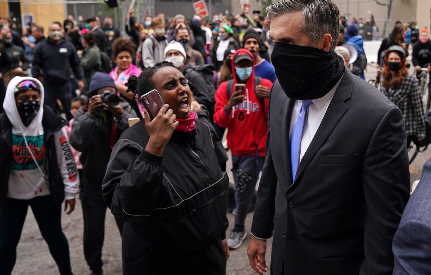 Former Minneapolis police officer Thomas Lane was screamed at by protesters as he walked to a car from the Hennepin County Family Justice Center following a hearing on several pending motions in the cases against four former officers in the killing of George Floyd. ] ANTHONY SOUFFLE • anthony.souffle@startribune.com A judge heard oral arguments on several pending motions in the cases against four former officers in the killing of George Floyd, including motions to dismiss the cases, Friday, Sept