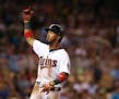 Minnesota Twins left fielder Eddie Rosario (20) reacted to being denied a single for the cycle when his eighth inning hit was nabbed by Seattle shorts