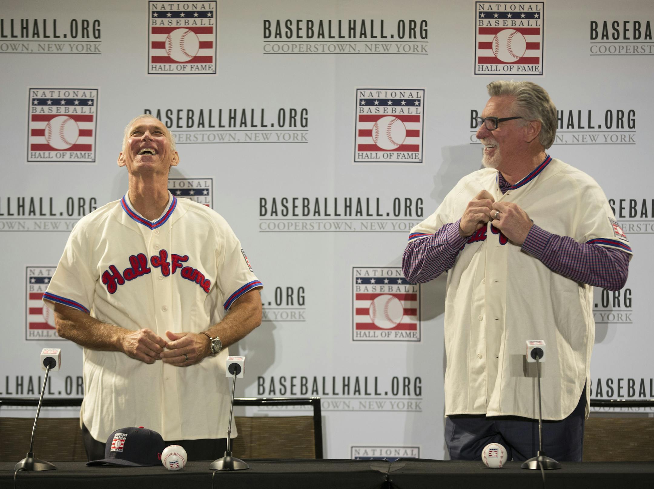 Newly elected Hall of Famers Alan Trammell, left, and Jack Morris, right, put their Hall of Fame jerseys on during the Major League Baseball winter meetings in Orlando, Fla., Monday, Dec. 11, 2017. (AP Photo/Willie J. Allen Jr.)
