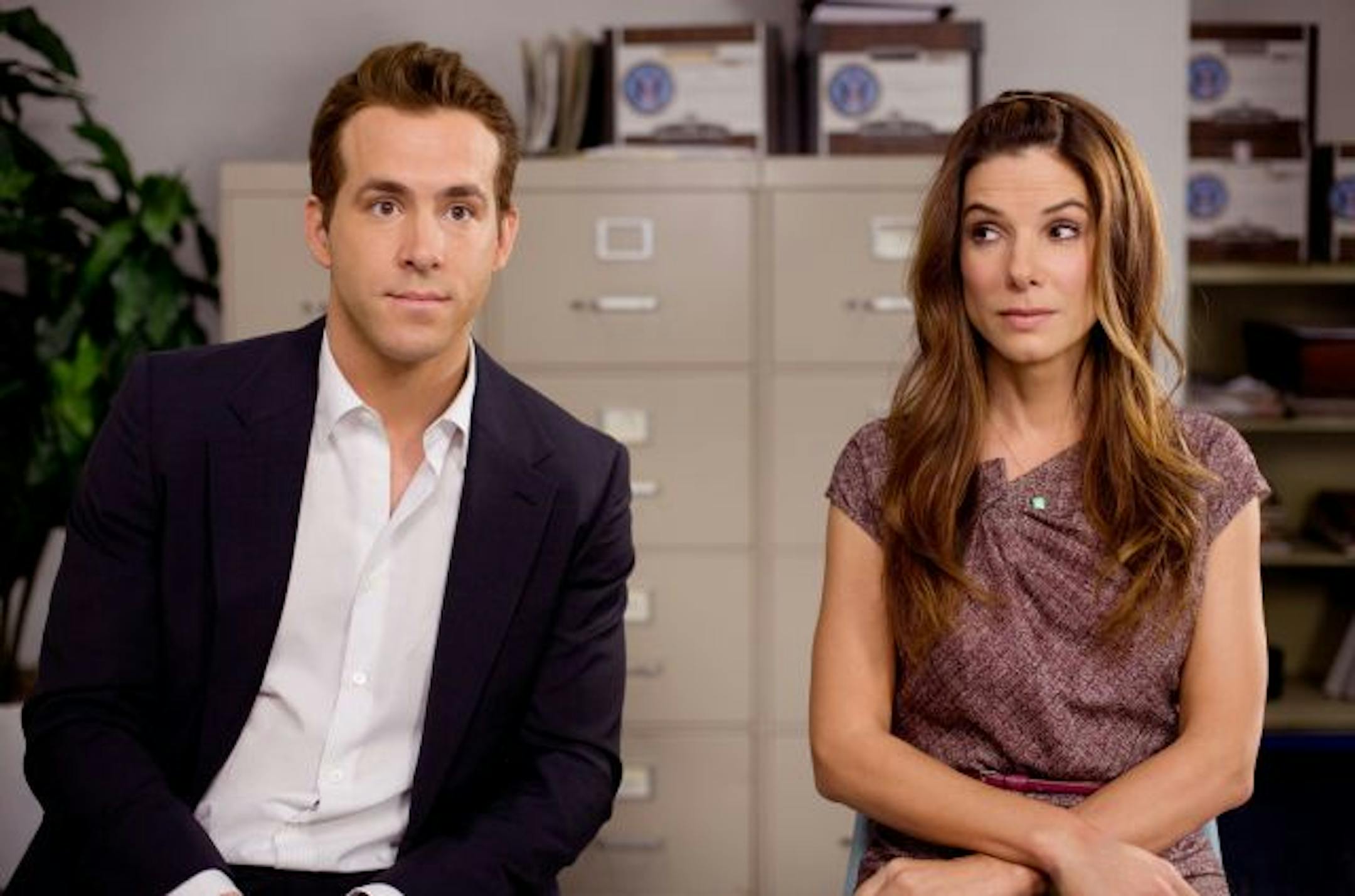Ryan Reynolds and Sandra Bullock are shown in a scene from Touchstone Pictures, "The Proposal".
