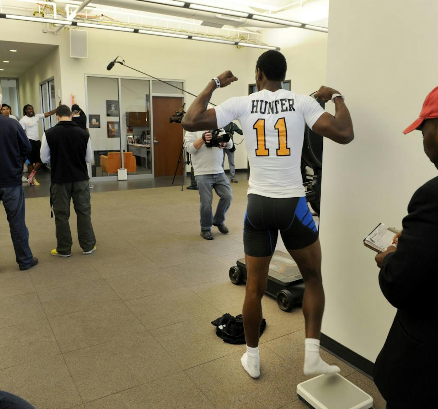 Wide receiver Justin Hunter strikes a pose after stepping off the scales during pro day at tge University of Tennessee, Wednesday, March 20, 2013, in Knoxville, Tenn.