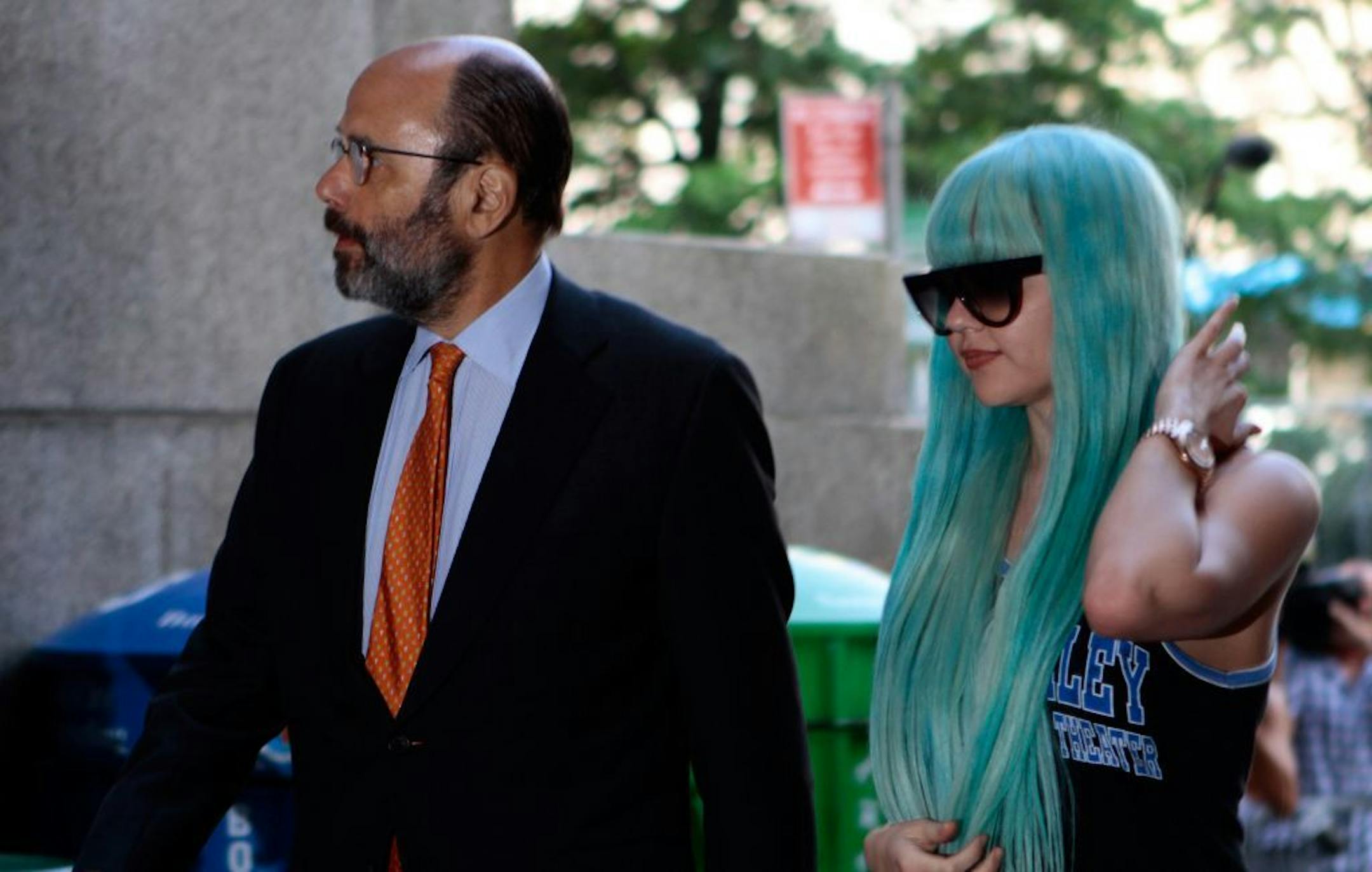 Amanda Bynes, accompanied by attorney Gerald Shargel, arrives for a court appearance in New York, Tuesday, July 9, 2013. The 27-year-old actress is charged with reckless endangerment and attempted tampering with physical evidence. Bynes was arrested in May after building officials called police to complain she was smoking pot in the lobby. Officers went to her apartment where they say they saw a bong sitting on the kitchen counter. Prosecutors say she tossed the bong out the window in front of t
