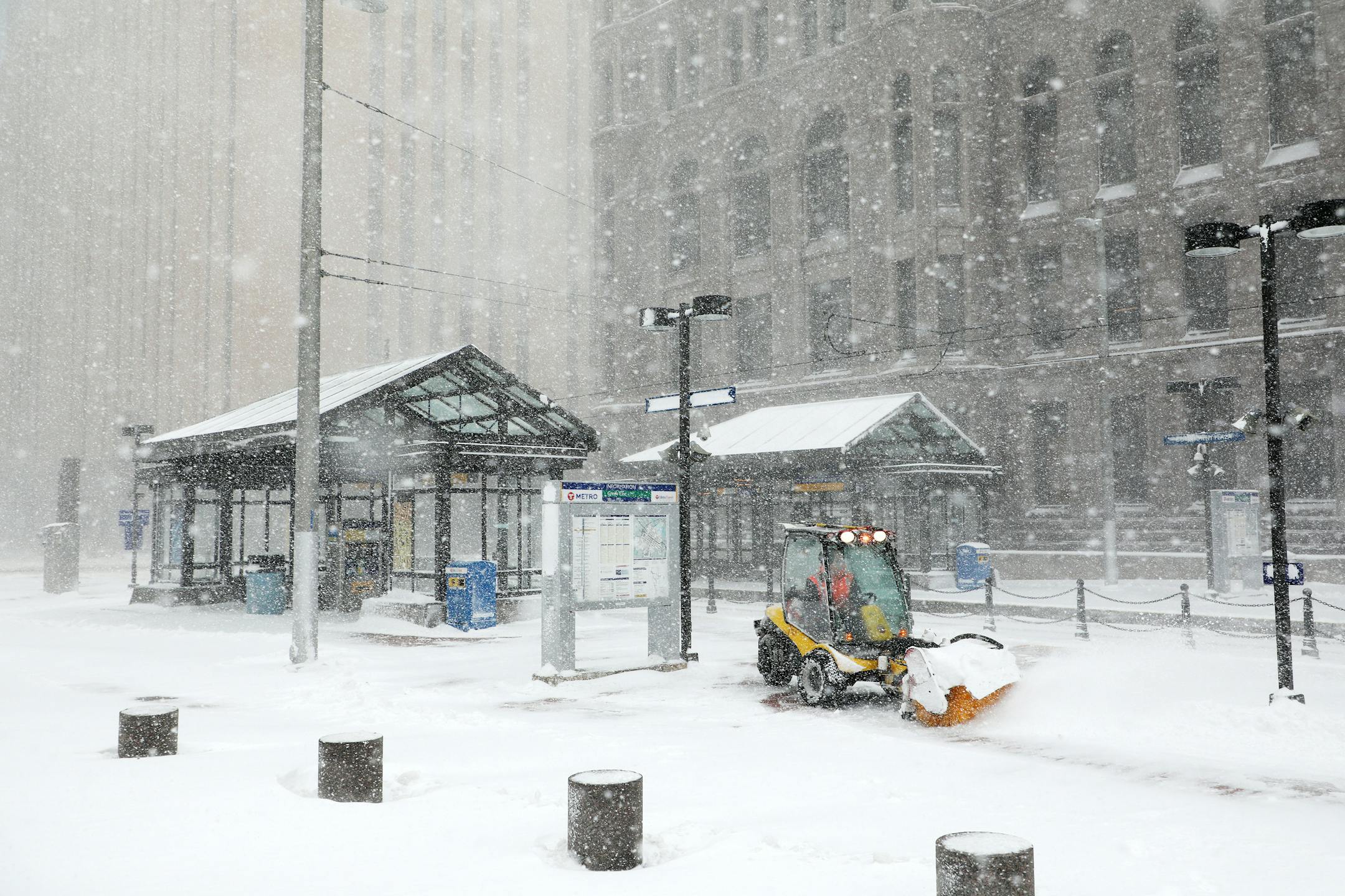 A worker tried to clear snow and ice from the Metro Government Center Plaza station during a storm last April.