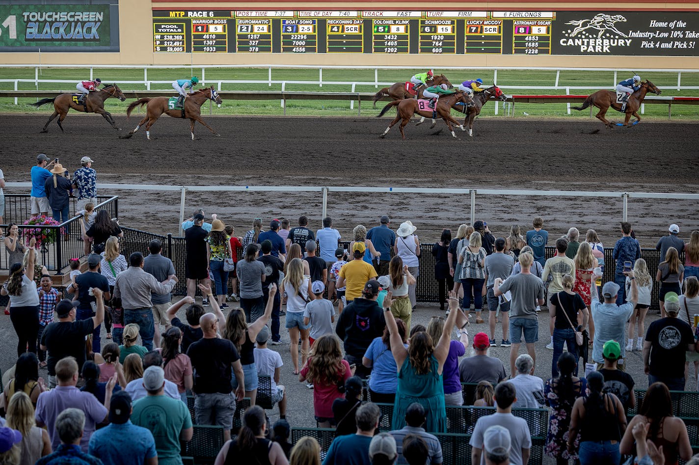 Race fans cheer on the horses during race seven on opening night at Canterbury Park in Shakopee, Minn., on Saturday, May 27, 2023. ] Elizabeth Flores • liz.flores@startribune.com