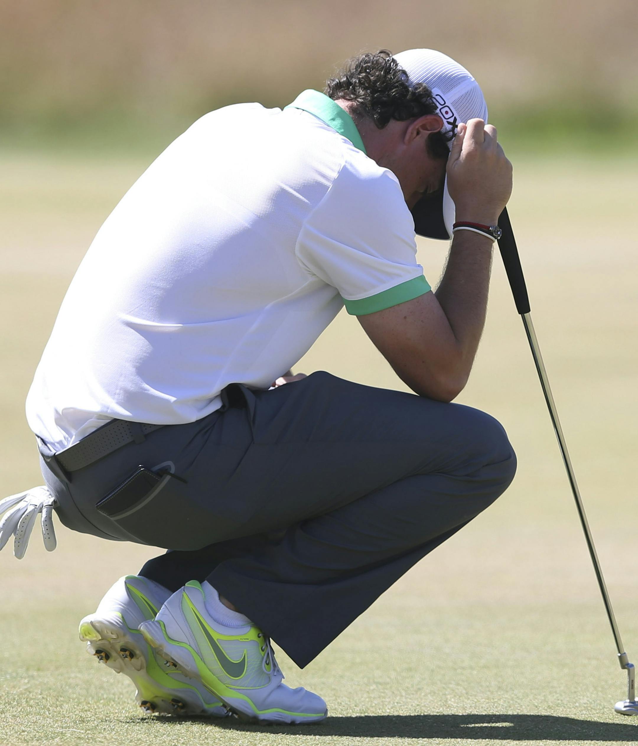 Rory McIlroy of Northern Ireland reacts after putting during the first round of the British Open Golf Championship at Muirfield, Scotland, Thursday July 18, 2013. (AP Photo/Scott Heppell)