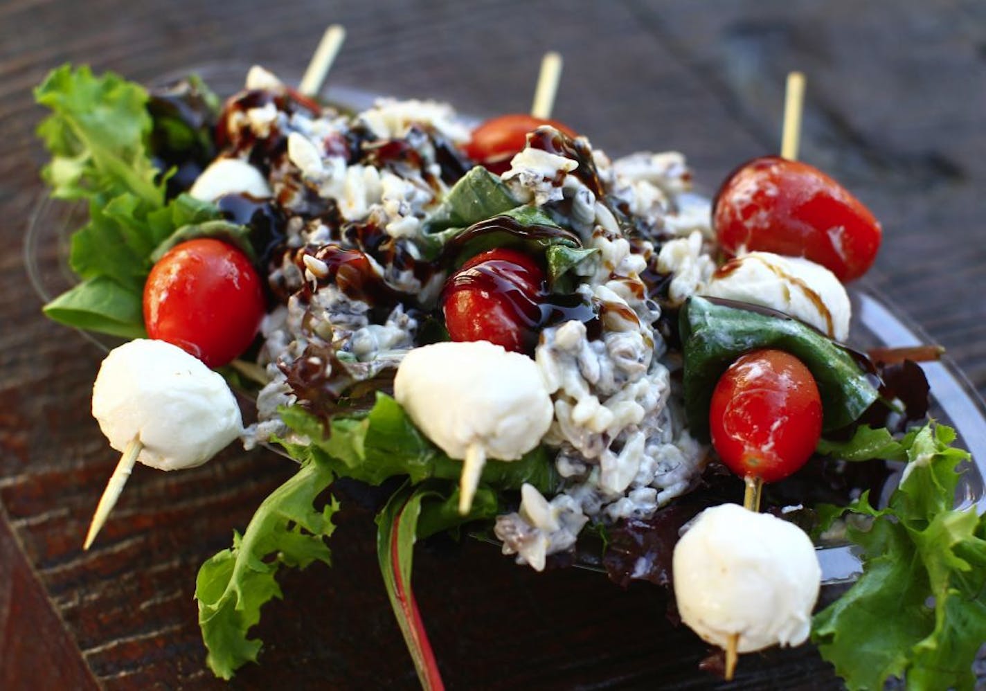 The Northwoods Salad on a Stick--three skewers of mozzarella, tomato and basil on a bed of wild rice salad and greens with balsamic glaze--is a healthy fair option available at Giggles' Campfire Grill at the Minnesota State Fair in St. Paul August 25, 2011.