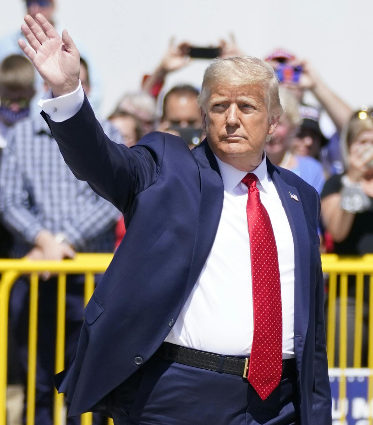 President Donald Trump wraps up speaking to a crowd of supporters at Minneapolis-Saint Paul International Airport, Monday, Aug. 17, 2020, in Minneapolis. (AP Photo/Evan Vucci) ORG XMIT: MNEV311