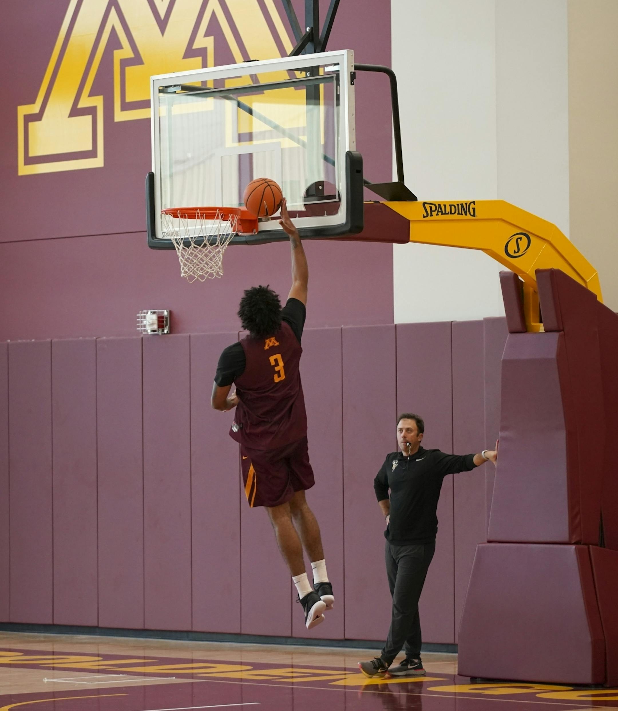 Head coach Richard Pitino watched while Jordan Murphy made a layup during a drill Tuesday afternoon.