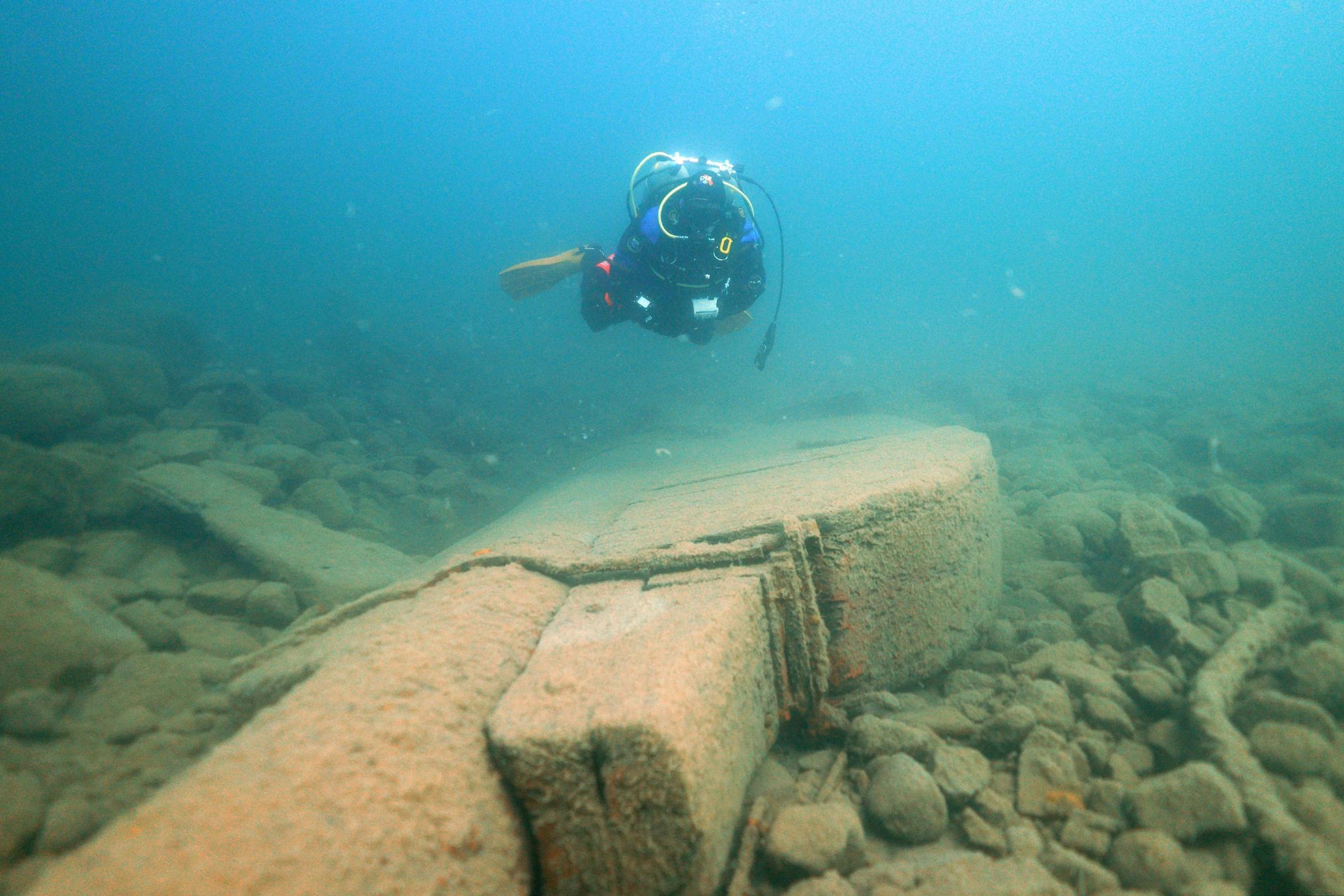 Jack Decker, a diver with the Great Lakes Shipwreck Preservation Society from Clear Lake, Iowa, swam over the massive rudder from the Hesper.