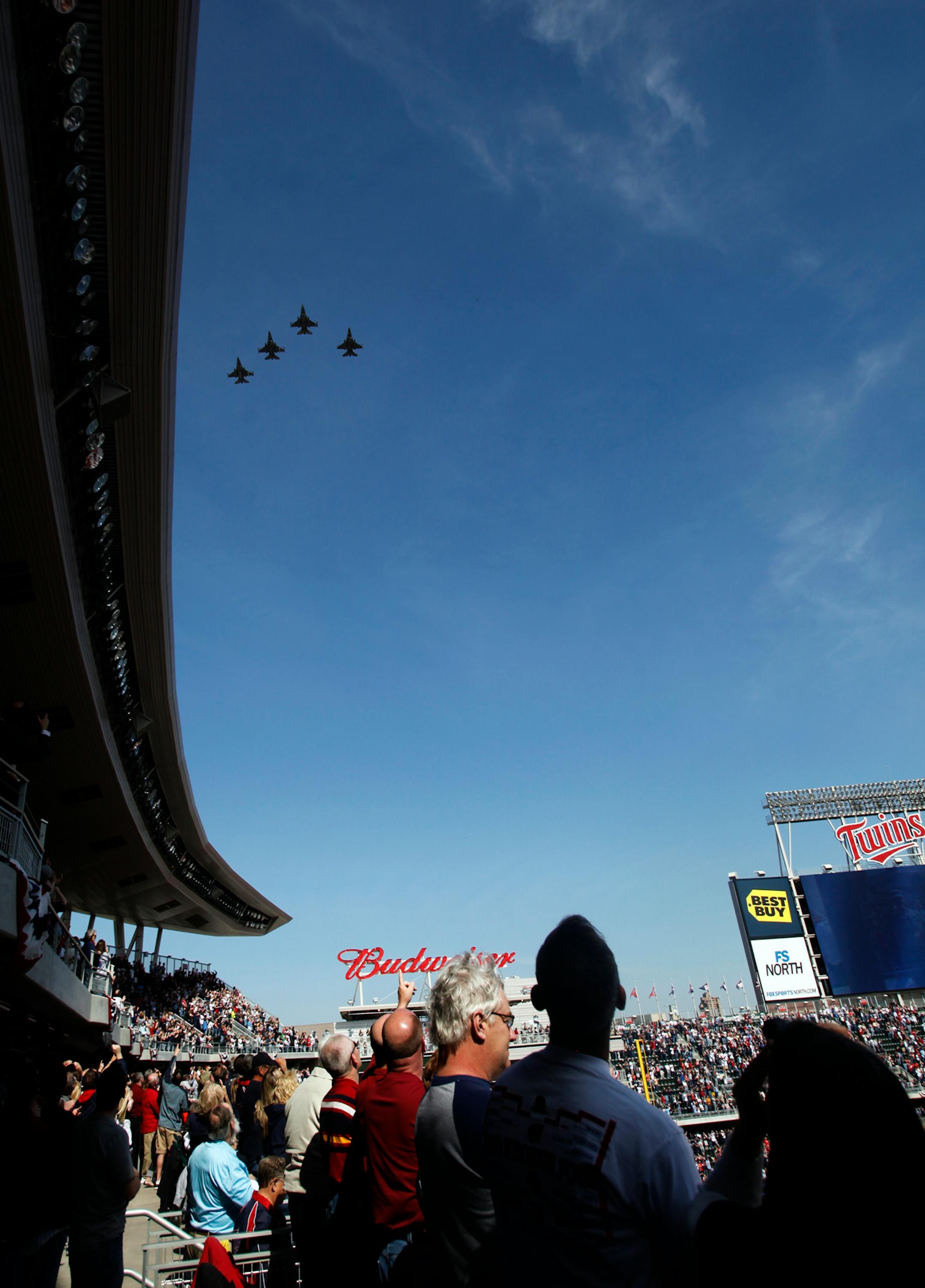 DAVID JOLES �\u20AC� djoles@startribune.com -April 8, 2011- Minneapolis, MN- : The Minnesota Twins home opener of 2011 against Oakland Athletcis. In this photo:] F-16 fighters planes fly over Target Field before the start of the game.